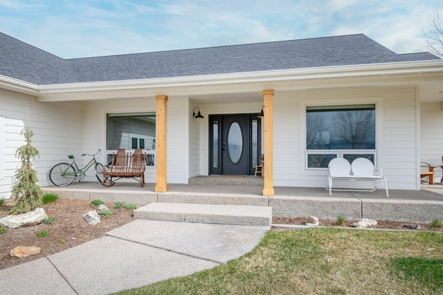 5632 Fairview Ln, Florence, MT 59833 - doorway to property with a porch and a shingled roof