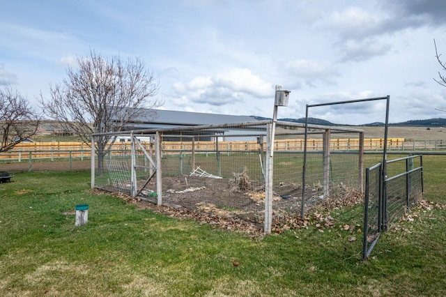 5632 Fairview Ln, Florence, MT 59833 - view of yard featuring exterior structure, an outbuilding, fence, and a rural view