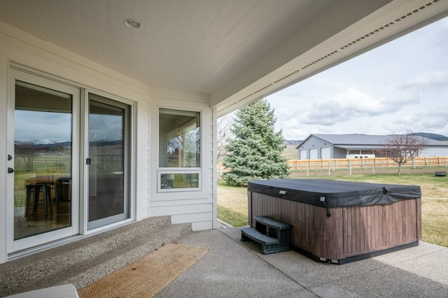 5632 Fairview Ln, Florence, MT 59833 - view of patio / terrace with a hot tub and fence