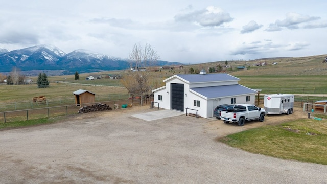 5632 Fairview Ln, Florence, MT 59833 - exterior space with a mountain view, fence, an outdoor structure, and a rural view