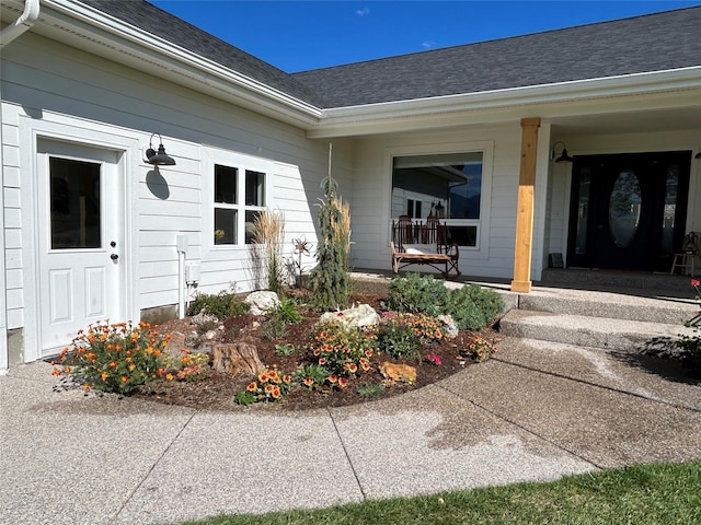 5632 Fairview Ln, Florence, MT 59833 - doorway to property with covered porch and roof with shingles
