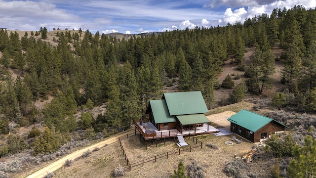 3340 Rome Ln, Stevensville, MT 59870 - view of patio / terrace featuring a deck and a view of trees