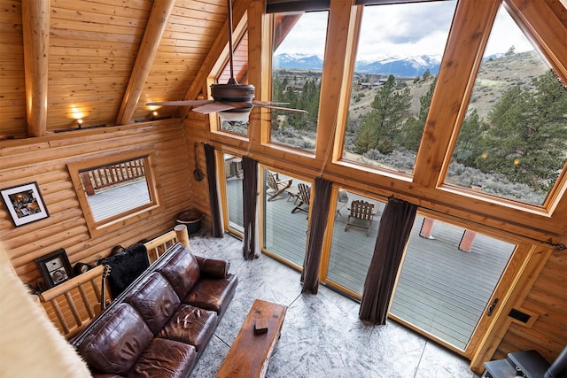 3340 Rome Ln, Stevensville, MT 59870 - living area featuring a mountain view, rustic walls, healthy amount of natural light, wooden ceiling with exposed beams, and high vaulted ceiling