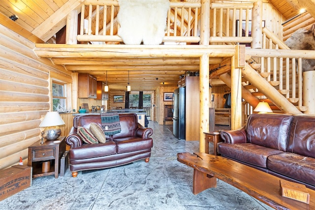 3340 Rome Ln, Stevensville, MT 59870 - living room with rustic walls, a towering ceiling, and wood ceiling