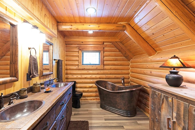 3340 Rome Ln, Stevensville, MT 59870 - bathroom with wooden ceiling, a soaking tub, rustic walls, double vanity, and wood finished floors