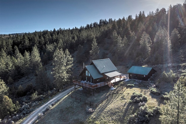 3340 Rome Ln, Stevensville, MT 59870 - aerial view of property and surrounding area featuring a heavily wooded area