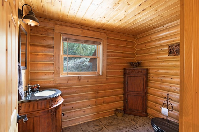 3340 Rome Ln, Stevensville, MT 59870 - bathroom featuring vanity, log walls, and wooden ceiling