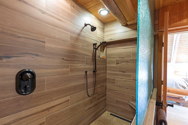 3340 Rome Ln, Stevensville, MT 59870 - bathroom with a tile shower, wooden ceiling, and wood walls