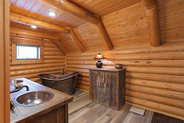 3340 Rome Ln, Stevensville, MT 59870 - bathroom with a sink, wood finished floors, wood ceiling with exposed beams, and rustic walls