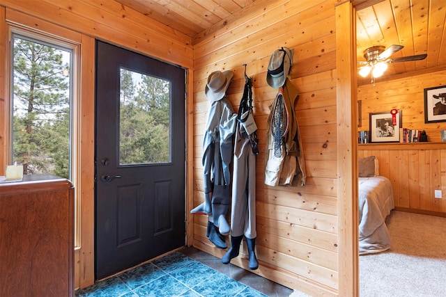 3340 Rome Ln, Stevensville, MT 59870 - entryway featuring wood walls, wood ceiling, and a ceiling fan