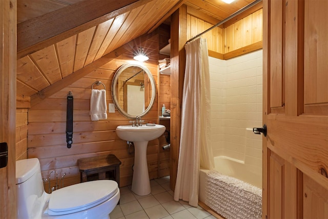 3340 Rome Ln, Stevensville, MT 59870 - full bath featuring wooden ceiling, wood walls, toilet, tile patterned floors, and vaulted ceiling