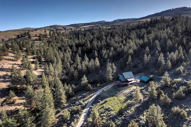 3340 Rome Ln, Stevensville, MT 59870 - aerial overview of property's location featuring mountains and a forest