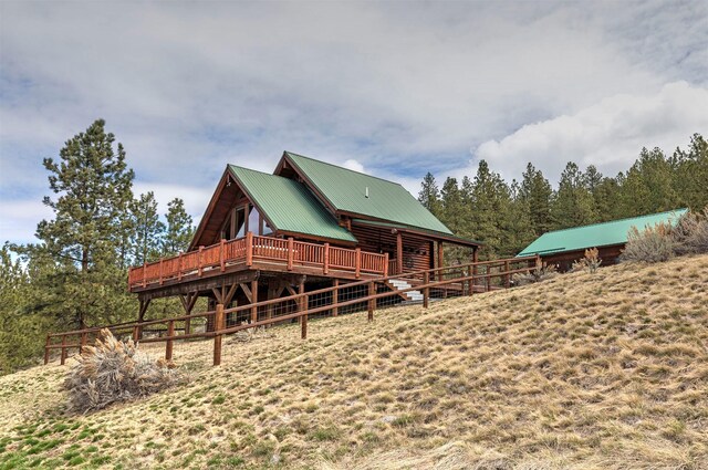 3340 Rome Ln, Stevensville, MT 59870 - rear view of house with metal roof