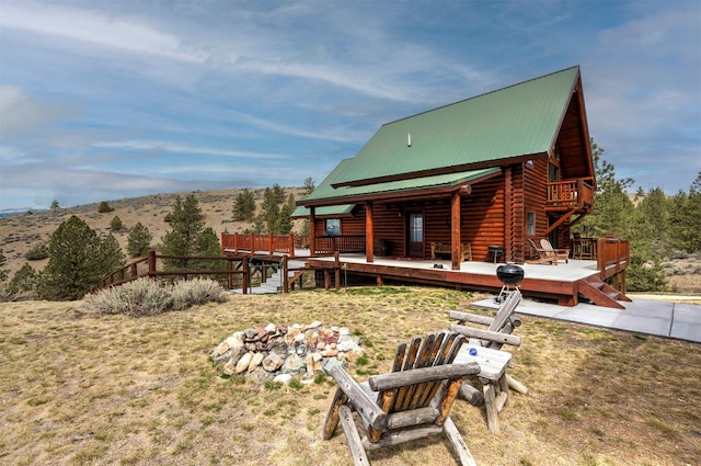 3340 Rome Ln, Stevensville, MT 59870 - rear view of property featuring a deck with mountain view and metal roof