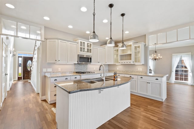 266 W Bowman Dr, Kalispell, MT 59901 - kitchen with recessed lighting, light wood-style flooring, stainless steel appliances, and a sink