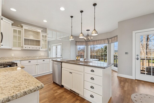 266 W Bowman Dr, Kalispell, MT 59901 - kitchen with dishwasher, a chandelier, a sink, and light wood finished floors