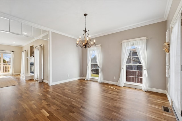 266 W Bowman Dr, Kalispell, MT 59901 - unfurnished dining area featuring an inviting chandelier, wood finished floors, visible vents, and a wealth of natural light