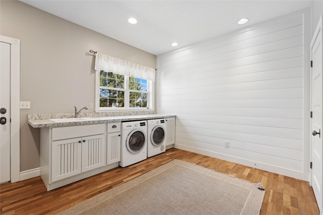 266 W Bowman Dr, Kalispell, MT 59901 - clothes washing area with light wood-type flooring, baseboards, a sink, and independent washer and dryer