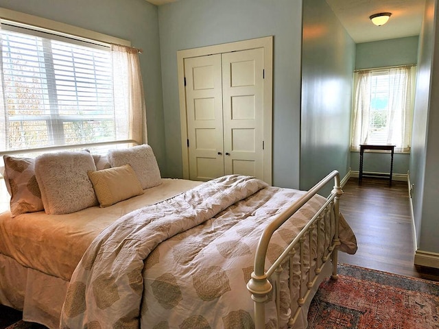 266 W Bowman Dr, Kalispell, MT 59901 - bedroom with baseboards, wood finished floors, and a closet