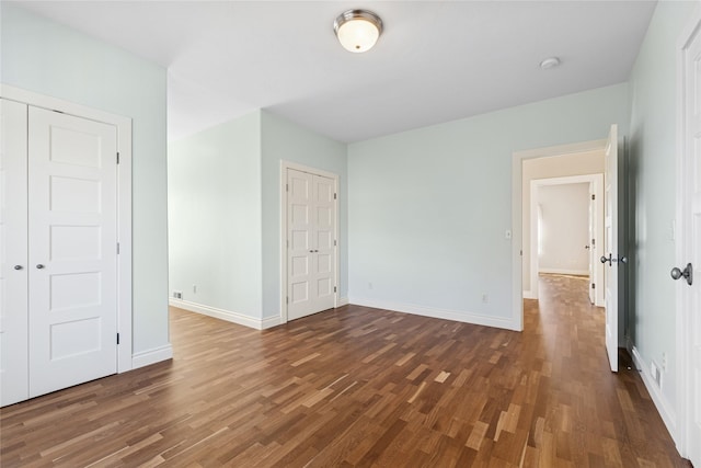 266 W Bowman Dr, Kalispell, MT 59901 - unfurnished bedroom with wood finished floors, a closet, and baseboards