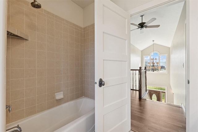 266 W Bowman Dr, Kalispell, MT 59901 - bathroom with vaulted ceiling, wood finished floors, shower / bath combination, and ceiling fan with notable chandelier