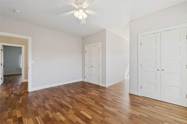 266 W Bowman Dr, Kalispell, MT 59901 - unfurnished bedroom with wood finished floors, baseboards, and ceiling fan