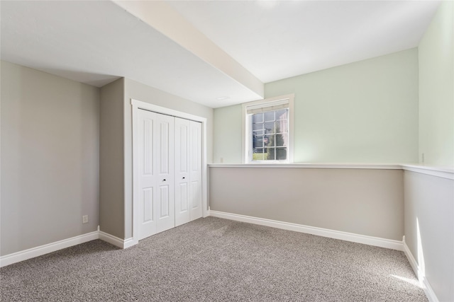 266 W Bowman Dr, Kalispell, MT 59901 - unfurnished bedroom with baseboards, carpet flooring, and a closet