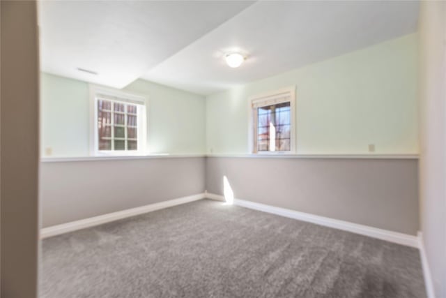 266 W Bowman Dr, Kalispell, MT 59901 - spare room with carpet floors, a healthy amount of sunlight, and baseboards