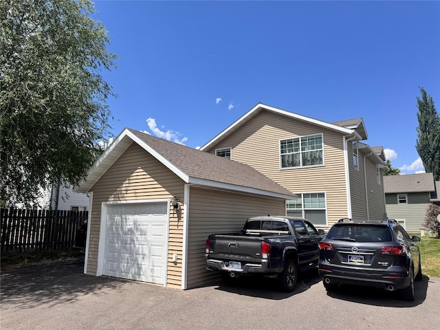 109 Justus Ln, Missoula, MT 59801 - view of side of home featuring an outbuilding, driveway, and a garage