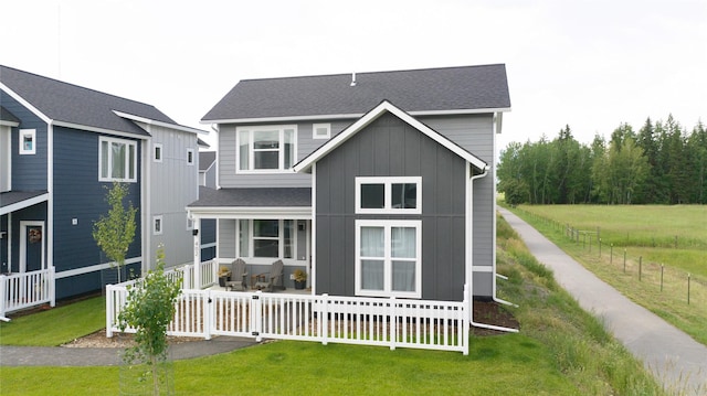 402 Trailview Way, Whitefish, MT 59937 - view of front of property featuring board and batten siding, a porch, and roof with shingles