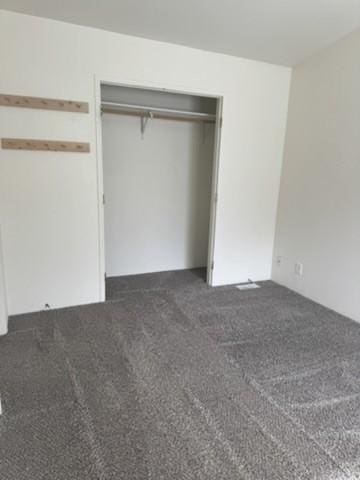 1930 N Hannaford St, Helena, MT 59601 - unfurnished bedroom with a closet and dark colored carpet