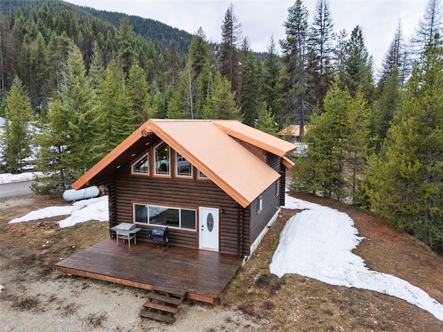37 Rudolph Ct, Haugan, MT 59842 - back of house with log siding, a forest view, and a wooden deck
