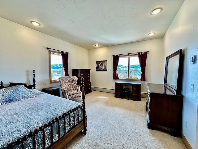 93 Golf Course Dr, Ennis, MT 59729 - bedroom featuring a baseboard heating unit, multiple windows, and light carpet
