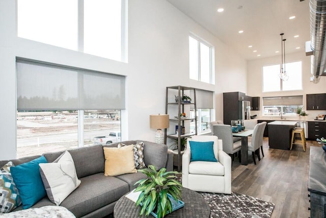 21D Hickory Loop, Whitefish, MT 59937 - living area featuring wood finished floors, a towering ceiling, and recessed lighting