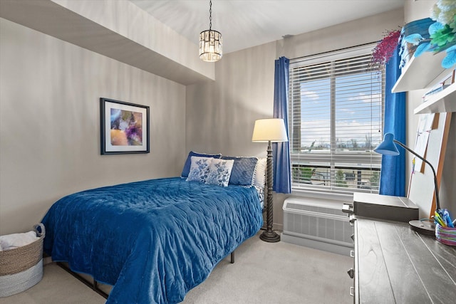 carpeted bedroom featuring a wall mounted AC