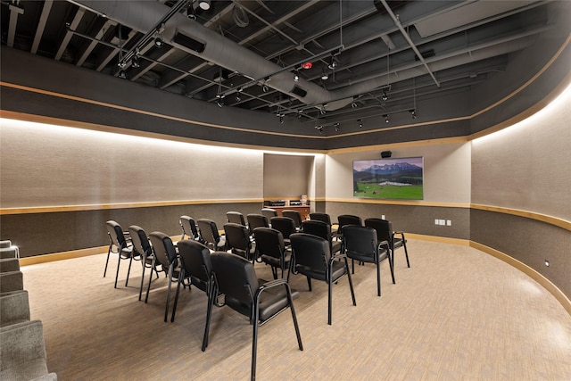 carpeted home theater with baseboards and visible vents