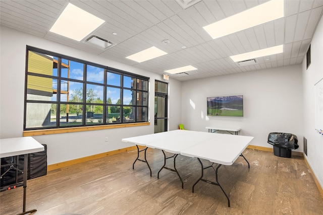 office with baseboards and wood finished floors