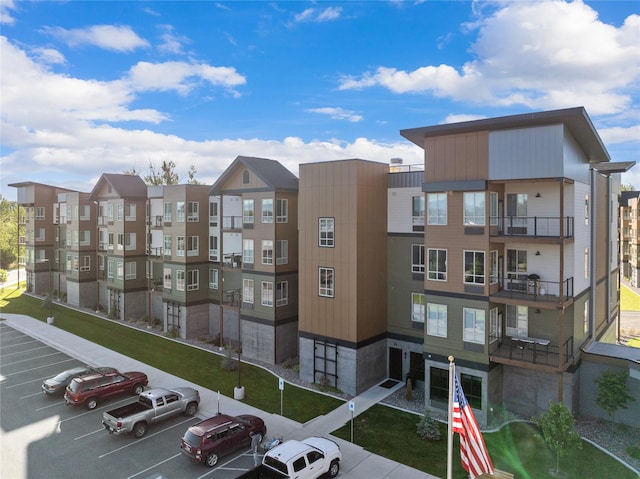 view of building exterior featuring uncovered parking