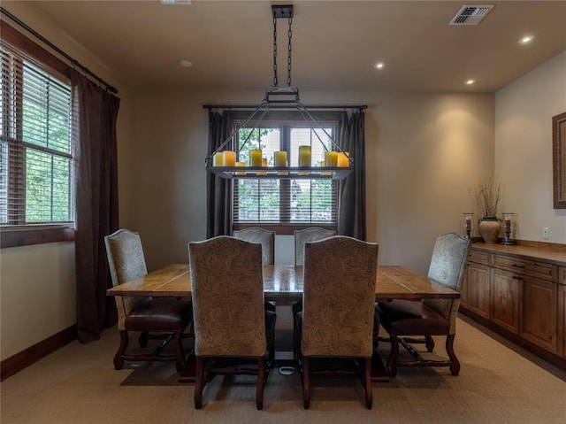 6104 Monterra Ave Unit L, Whitefish, MT 59937 - dining room featuring plenty of natural light, recessed lighting, light carpet, and a chandelier