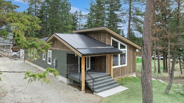 view of front of home with covered porch and metal roof