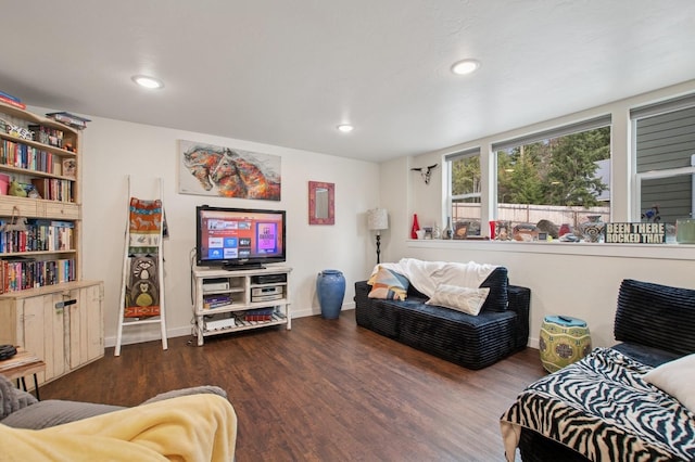 living area with baseboards, recessed lighting, and wood finished floors