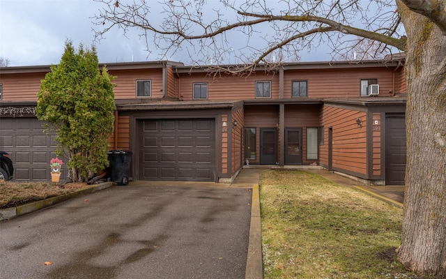 80 Hawthorn W, Kalispell, MT 59901 - view of front facade with a garage, driveway, and a front lawn