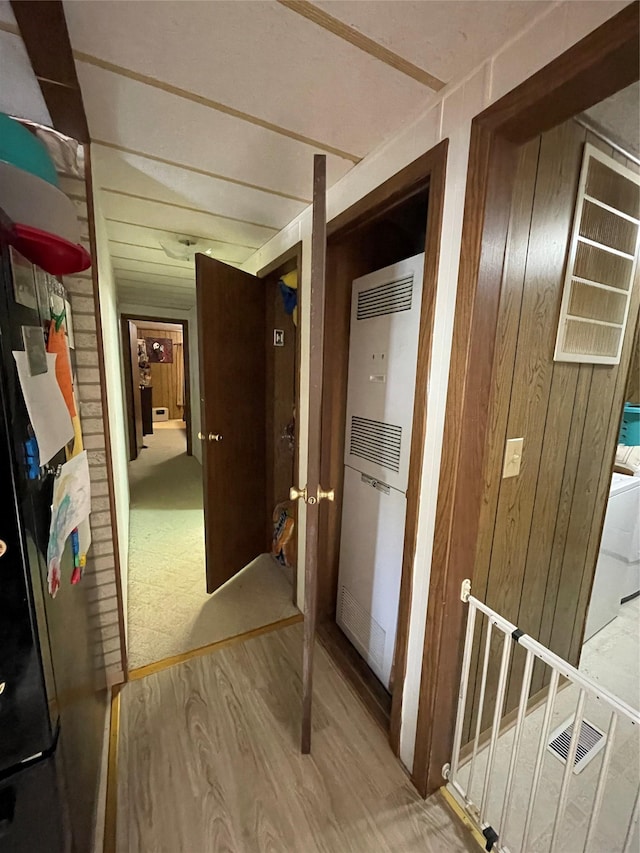 381 Lyng Ave W, Highwood, MT 59450 - hall with a heating unit, wood finished floors, and wooden walls