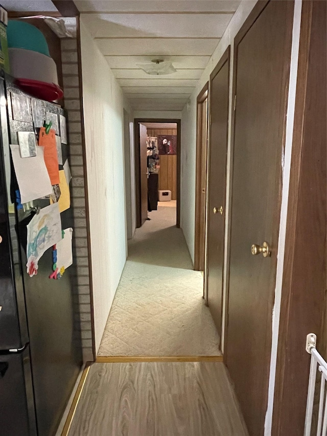 corridor featuring light wood-style flooring
