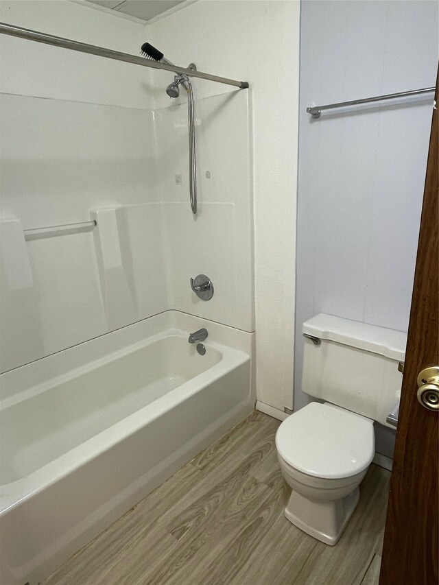 381 Lyng Ave W, Highwood, MT 59450 - full bath featuring wood finished floors, bathing tub / shower combination, and toilet