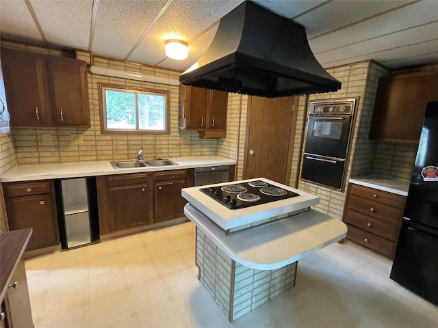 381 Lyng Ave W, Highwood, MT 59450 - kitchen with island exhaust hood, black appliances, a sink, and light flooring