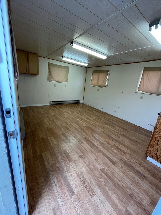 381 Lyng Ave W, Highwood, MT 59450 - finished below grade area with light wood-style floors and a baseboard heating unit