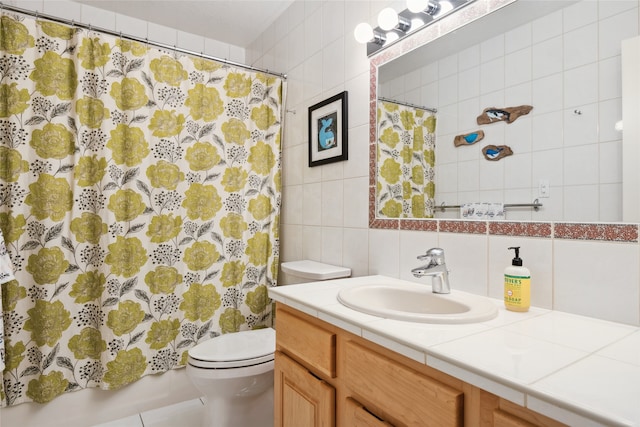 bathroom featuring tile walls, toilet, vanity, tasteful backsplash, and a shower with shower curtain