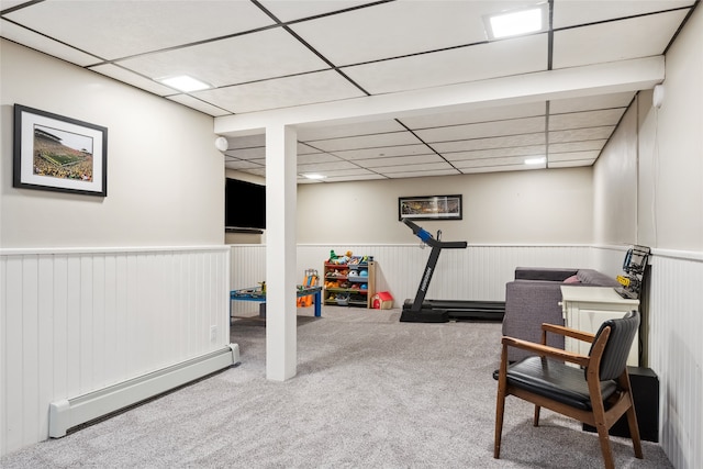 game room with a baseboard heating unit, a paneled ceiling, wainscoting, and carpet flooring
