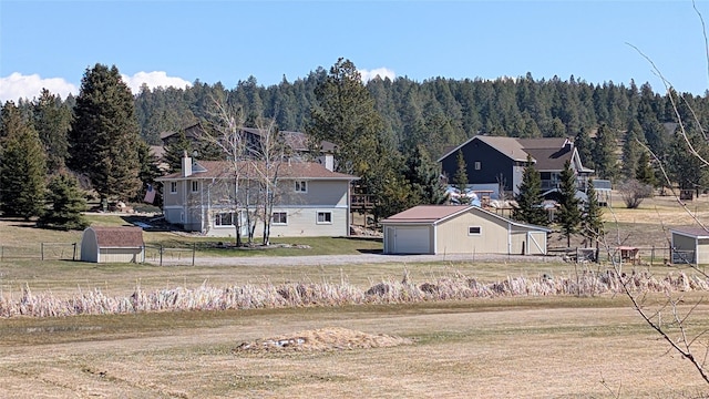 exterior space featuring a view of trees